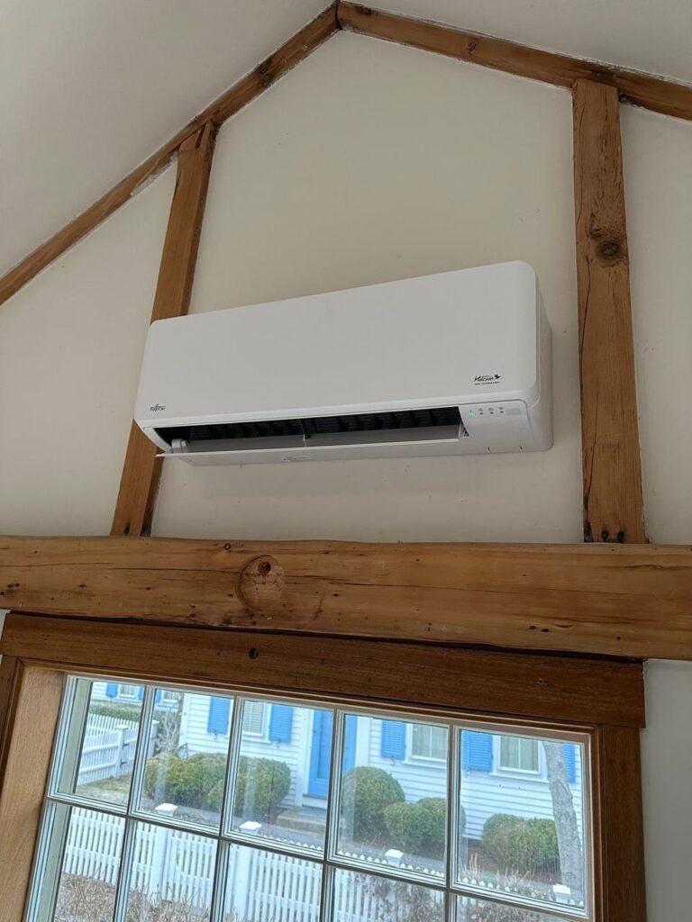 Fujitsu ductless mini-split indoor unit mounted below exposed wood beams