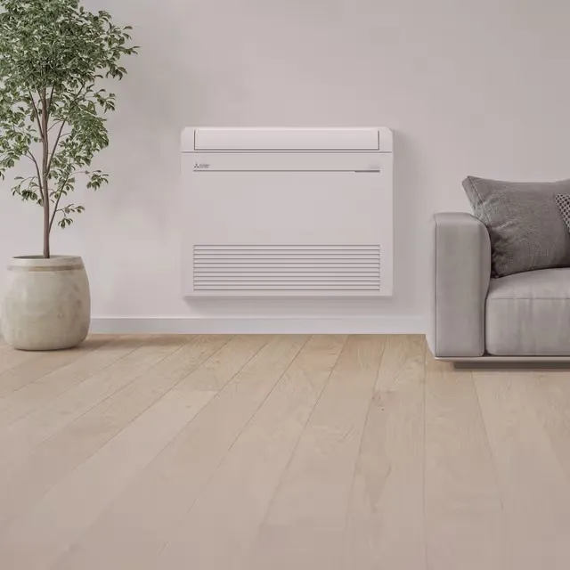 Floor-mounted mini-split unit in a living room (Mitsubishi Electric)